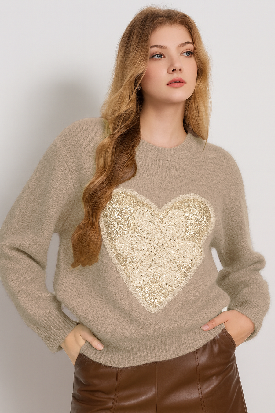 knitted jumper with heart shaped sequins encasing a laced flower design