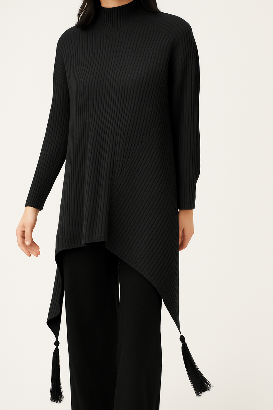 SOFT MULTI DIRECTIONAL KNIT JUMPER WITH ELONGATED SIDES AND TASSELS