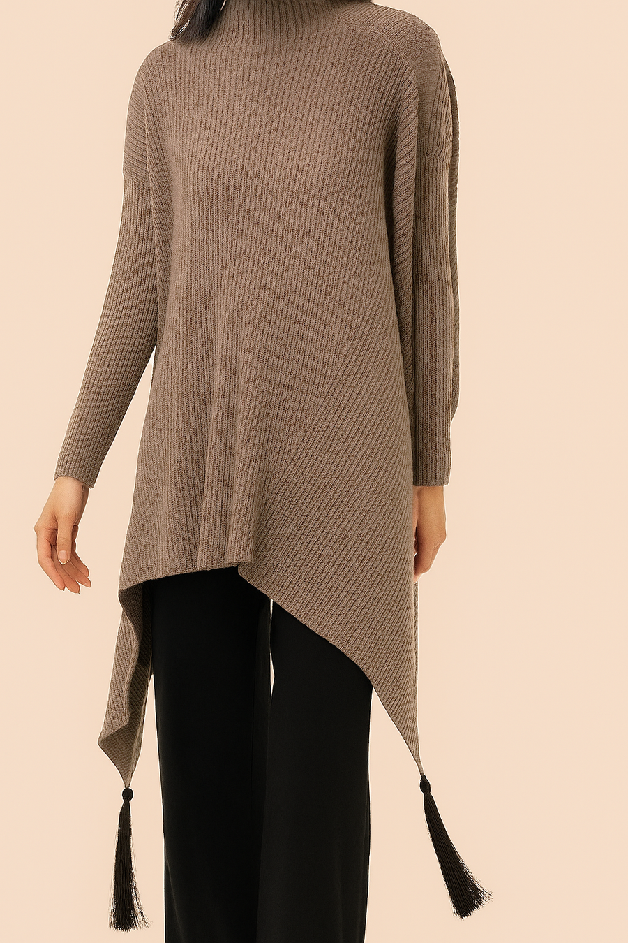 SOFT MULTI DIRECTIONAL KNIT JUMPER WITH ELONGATED SIDES AND TASSELS