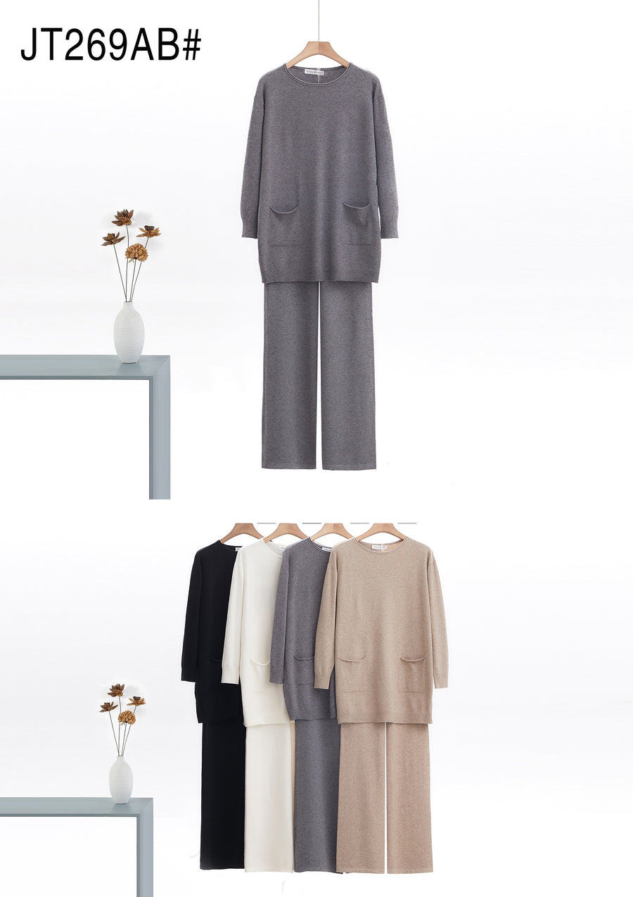 Soft Knit Elongated Jumper With Pockets And Cable Design Sides Matched With Wide Leg Trousers