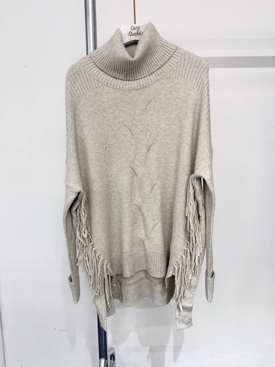 Soft Knit Jumper With Roll Neck,Rolled Sleeve Cuffs, Ribbed Shoulders, Cable Knit Design On Front And Side Tassels