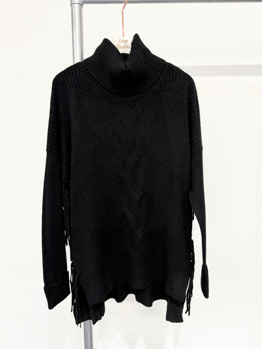 Soft Knit Jumper With Roll Neck,Rolled Sleeve Cuffs, Ribbed Shoulders, Cable Knit Design On Front And Side Tassels