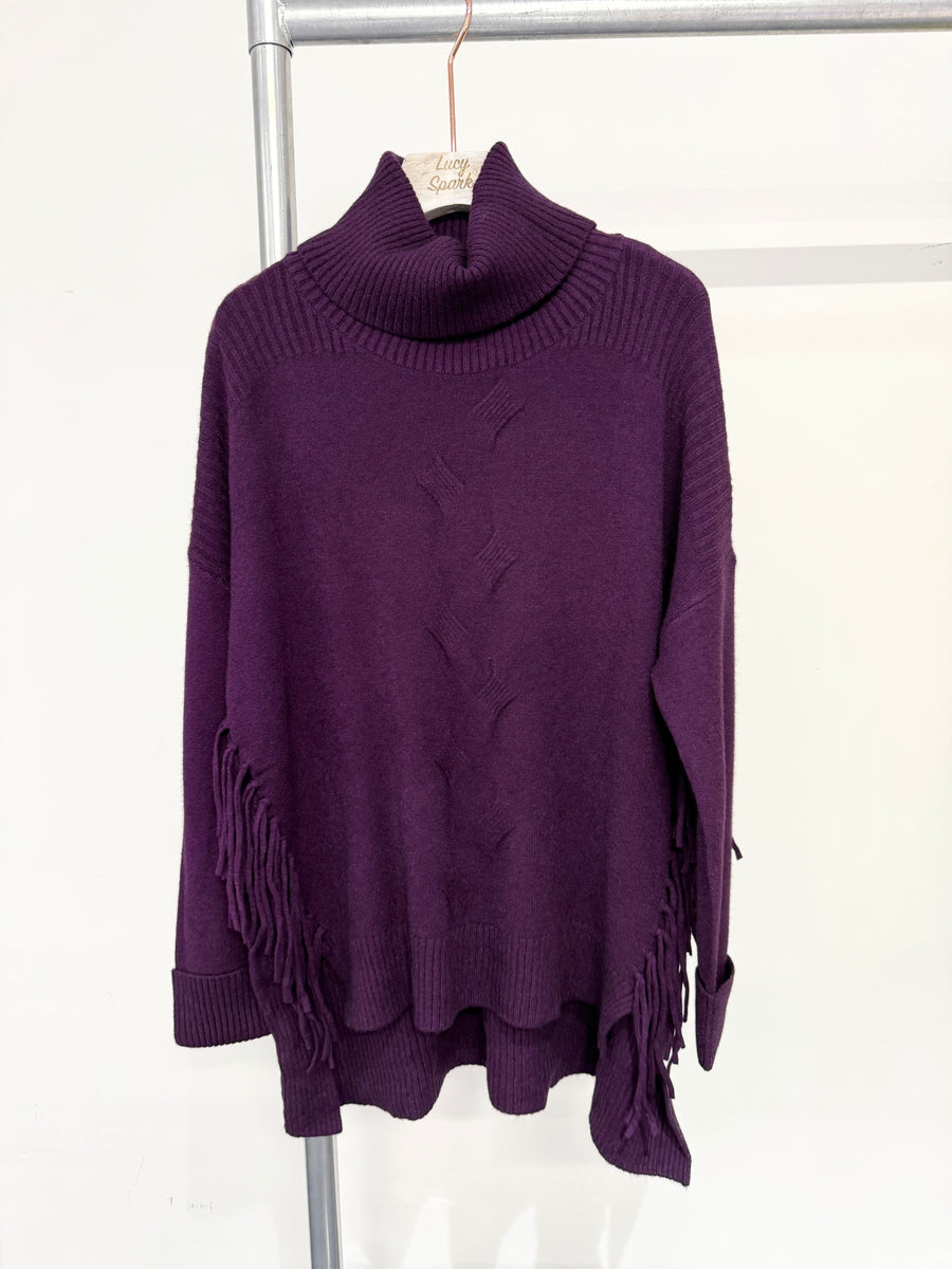 Soft Knit Jumper With Roll Neck,Rolled Sleeve Cuffs, Ribbed Shoulders, Cable Knit Design On Front And Side Tassels