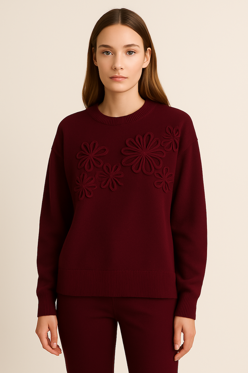 soft knit jumper with round neck and decorative laced flower design at the front